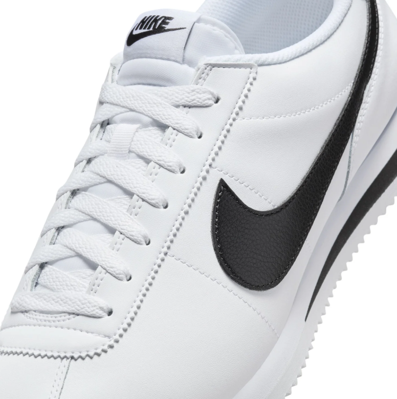 Nike White Low-Top Sneakers with Black Swoosh Details