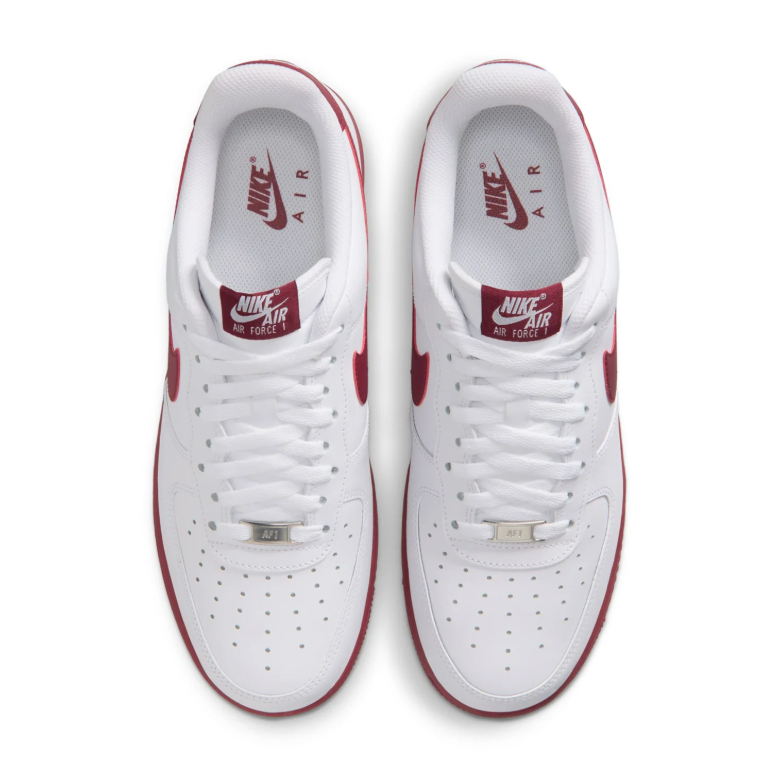 Nike White Low-Top Sneakers with Burgundy Swoosh and Soles