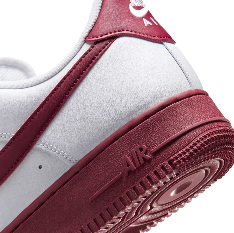 Nike White Low-Top Sneakers with Burgundy Swoosh and Soles