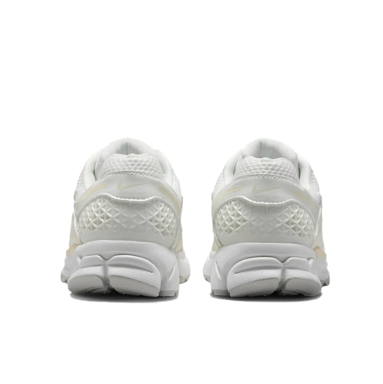 Nike Low-Top Sneakers – White and Cream with Sculpted Sole