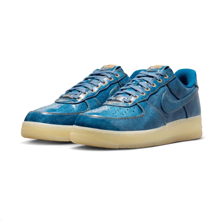 Nike Blue Low-Top Sneakers with Cream Soles and Metallic Eyelets