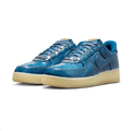 Nike Blue Low-Top Sneakers with Cream Soles and Metallic Eyelets